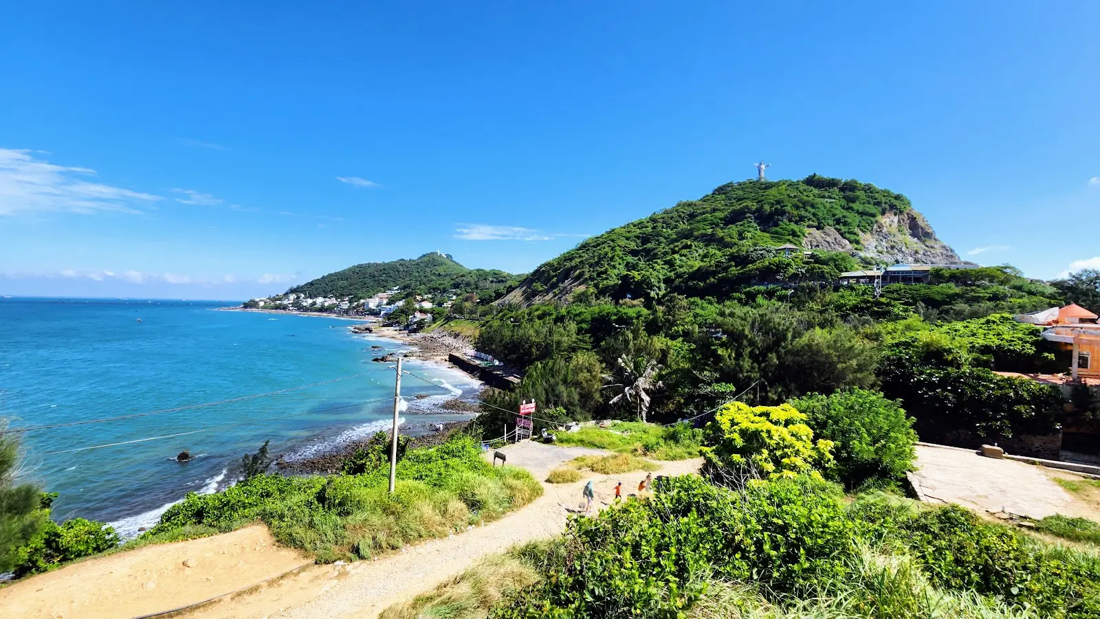 Nghinh Phong Beach's intimate and secluded setting with dramatic cape formations creating natural privacy
